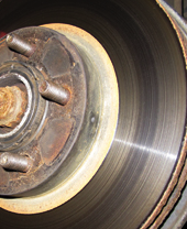 The dusty clay color  is the transfer layer deposited by the brake pad.